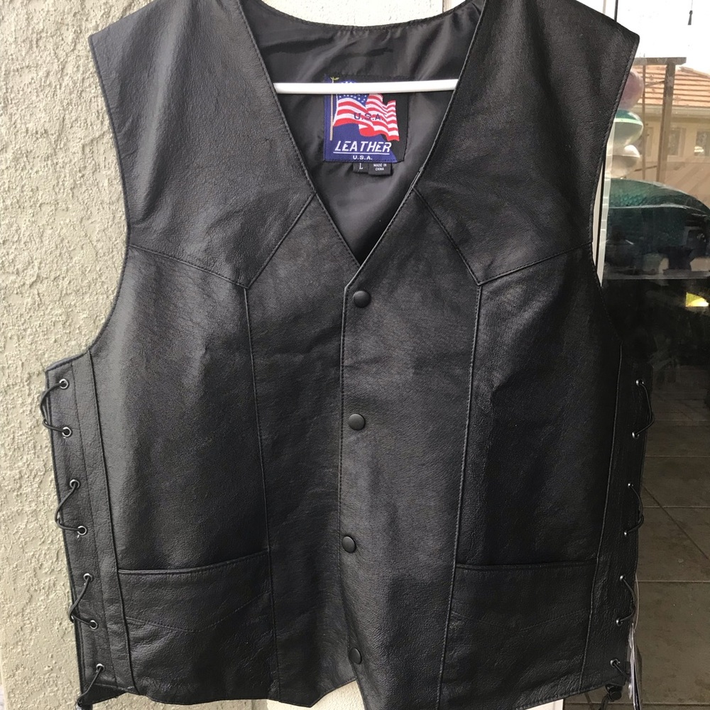 Leather vest, brand new with tags. Size large